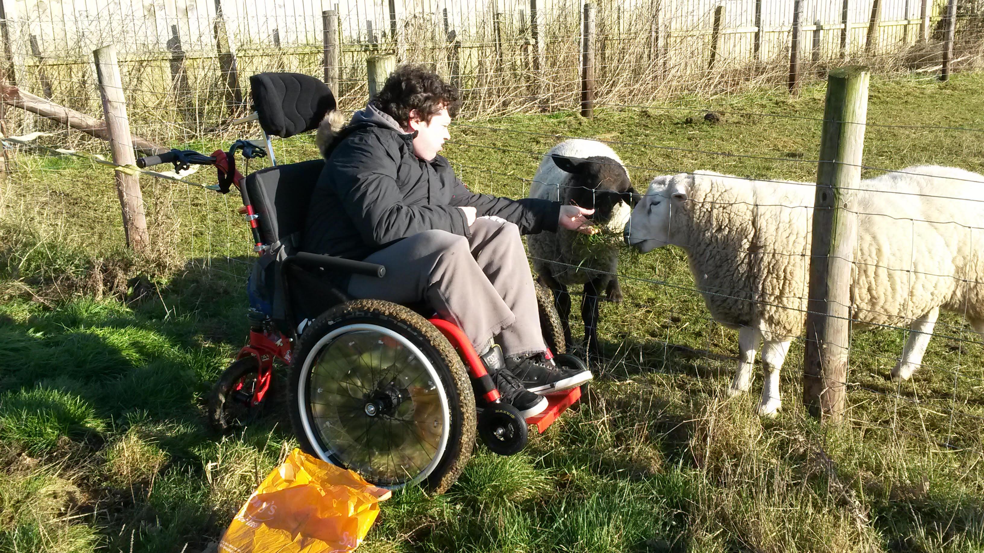 Joby can enjoy the farm thanks to his all terrain attendant wheelchair - the MT Push
