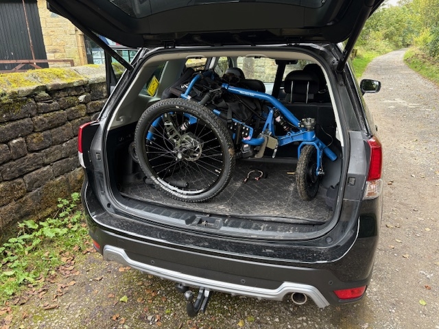 all terrain wheelchair folded and sat in the boot of a car